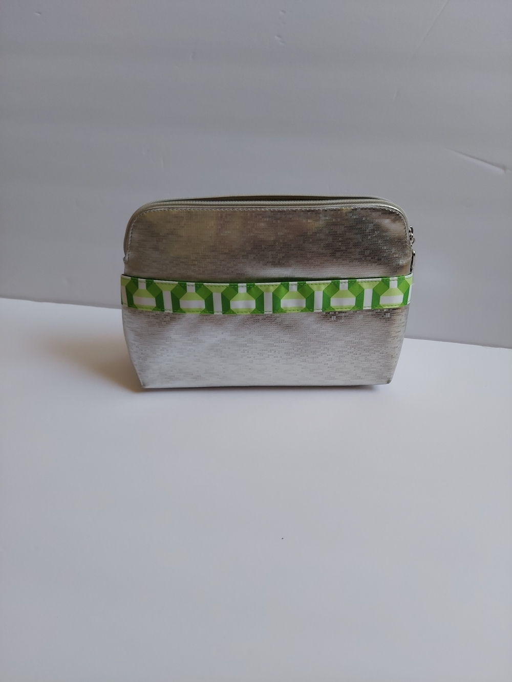 Clinique  Lightweight Silver Cosmetic Bag with Green Pattern Trim